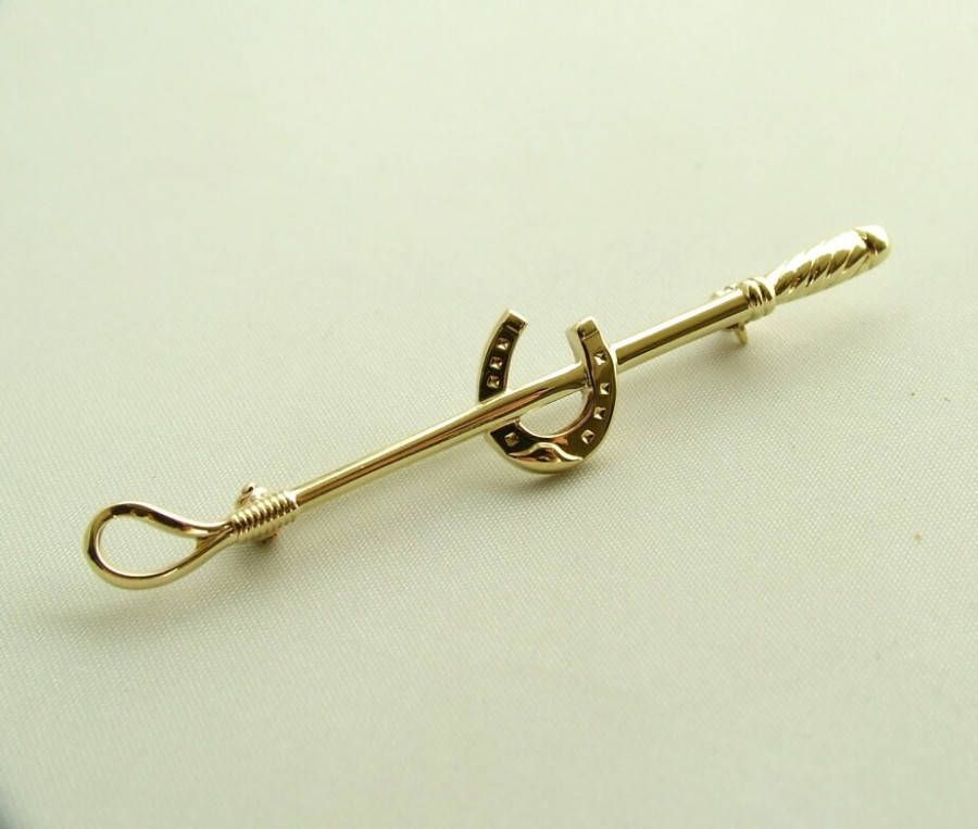 Atelier Christian Gouden broche(zweep met hoefijzer )