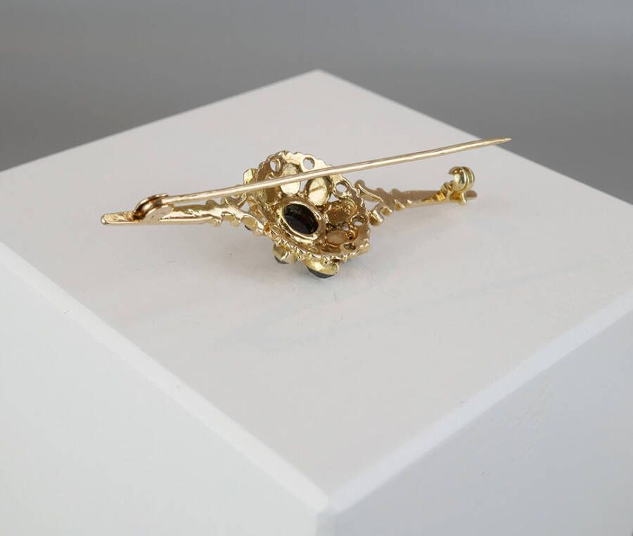 Christian Gouden broche met granaten